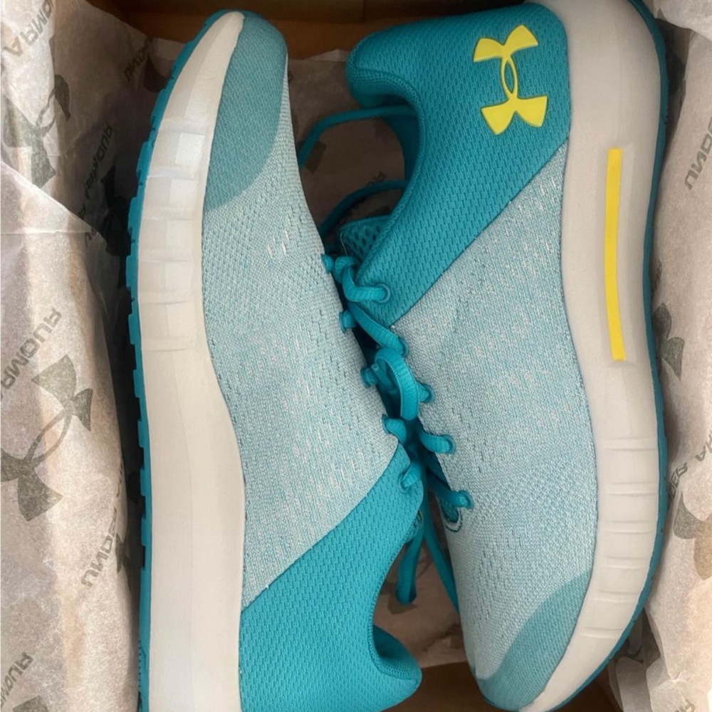 Under Armour Youth 6.5 GCS Pursuit. They are a shade of blues/grey/yellow